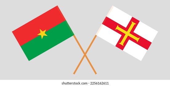 Gekreuzte Flaggen von Burkina Faso und Bailiwick von Guernsey. Offizielle Farben. Richtiger Anteil. Vektorgrafik
