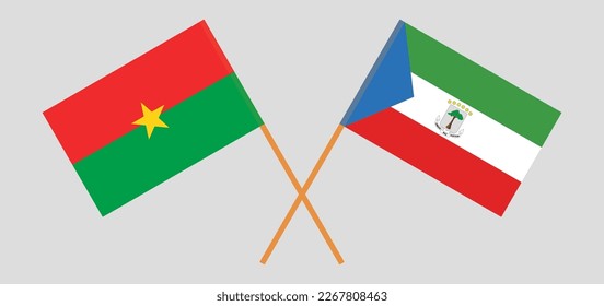 Gekreuzte Flaggen von Burkina Faso und Äquatorialguinea. Offizielle Farben. Richtiger Anteil. Vektorgrafik
