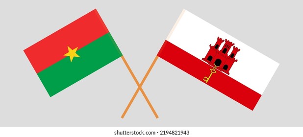 Gekreuzte Flaggen von Burkina Faso und Gibraltar. Offizielle Farben. Richtiger Anteil. Vektorgrafik
