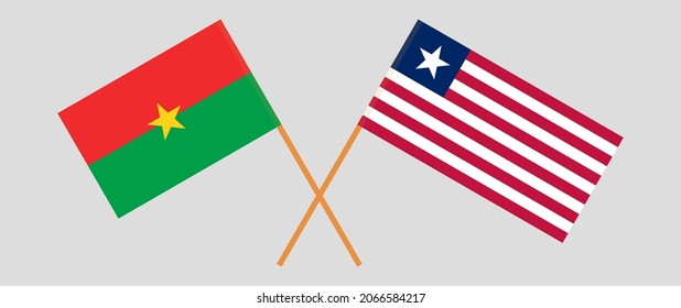 Gekreuzte Flaggen von Burkina Faso und Liberia. Offizielle Farben. Richtiger Anteil