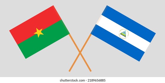 Gekreuzte Flaggen von Burkina Faso und Nicaragua. Offizielle Farben. Richtiger Anteil. Vektorgrafik
