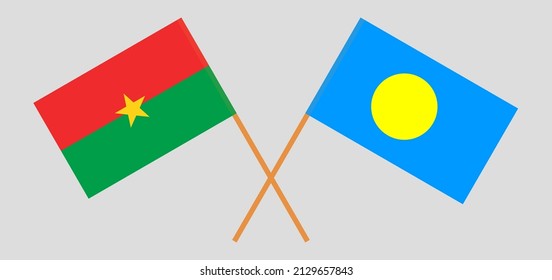 Überkreuzte Flaggen von Burkina Faso und Palau. Offizielle Farben. Richtiger Anteil. Vektorgrafik
