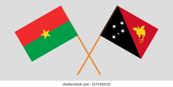 Gekreuzte Flaggen von Burkina Faso und Papua-Neuguinea. Offizielle Farben. Richtiger Anteil. Vektorgrafik
