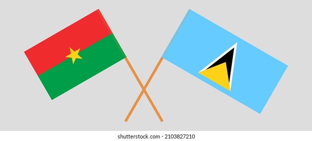 Überquerte Flaggen von Burkina Faso und Saint Lucia. Offizielle Farben. Richtiger Anteil. Vektorgrafik
