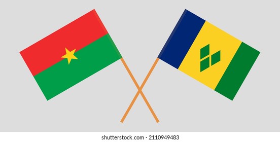 Überkreuzte Flaggen von Burkina Faso und St. Vincent und die Grenadinen. Offizielle Farben. Richtiger Anteil. Vektorgrafik
