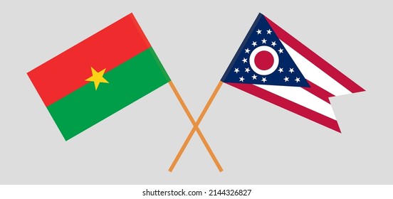 Überquerte Flaggen von Burkina Faso und dem Staat Ohio. Offizielle Farben. Richtiger Anteil. Vektorgrafik
