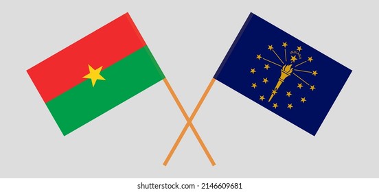 Überquerte Flaggen von Burkina Faso und dem Bundesstaat Indiana. Offizielle Farben. Richtiger Anteil. Vektorgrafik
