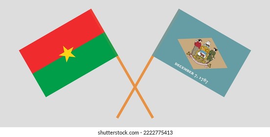 Überquerte Flaggen von Burkina Faso und dem Staat Delaware. Offizielle Farben. Richtiger Anteil. Vektorgrafik
