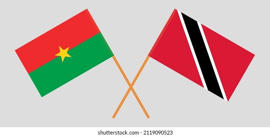 Gekreuzte Flaggen von Burkina Faso und Trinidad und Tobago. Offizielle Farben. Richtiger Anteil. Vektorgrafik
