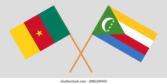 Crossed flags of Cameroon and the Comoros. Official colors. Correct proportion. Vector illustration
