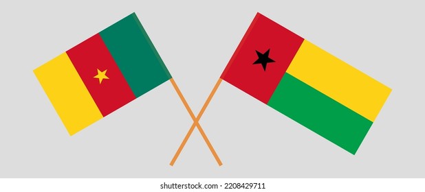 Crossed flags of Cameroon and Guinea-Bissau. Official colors. Correct proportion. Vector illustration
