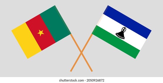 Überquerte Flaggen Kameruns und des Königreichs Lesotho. Offizielle Farben. Richtiger Anteil