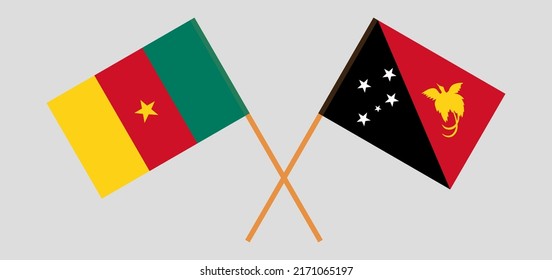 Banderas cruzadas de Camerún y Papúa Nueva Guinea. Colores oficiales. Proporción correcta. Ilustración del vector
