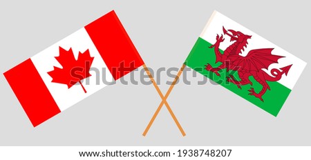 Crossed flags of Canada and Wales. Official colors. Correct proportion
