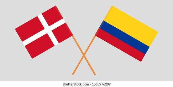 Crossed flags of Colombia and Denmark. Official colors. Correct proportion. Vector illustration
