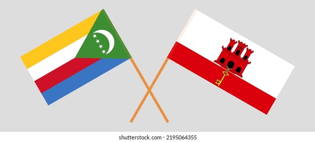 Banderas cruzadas de las Comoras y Gibraltar. Colores oficiales. Proporción correcta. Ilustración del vector

