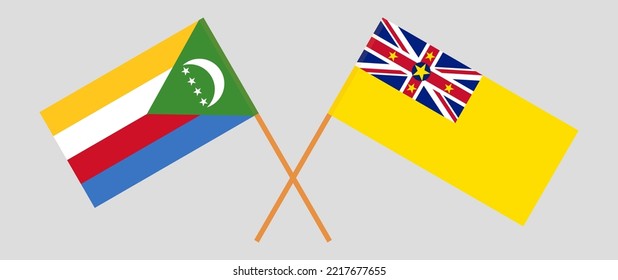 Crossed flags of the Comoros and Niue. Official colors. Correct proportion. Vector illustration
