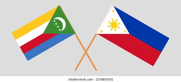 Crossed flags of the Comoros and the Philippines. Official colors. Correct proportion. Vector illustration
