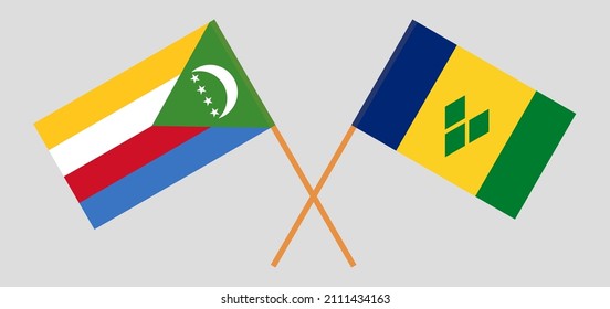Crossed flags of the Comoros and Saint Vincent and the Grenadines. Official colors. Correct proportion. Vector illustration
