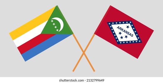 Crossed flags of the Comoros and The State of Arkansas. Official colors. Correct proportion. Vector illustration
