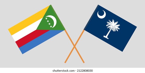 Überquerte Flaggen der Komoren und des Staates South Carolina. Offizielle Farben. Richtiger Anteil. Vektorgrafik
