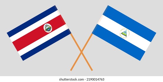 Crossed flags of Costa Rica and Nicaragua. Official colors. Correct proportion. Vector illustration
