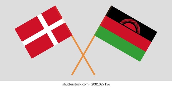Crossed flags of Denmark and Malawi. Official colors. Correct proportion