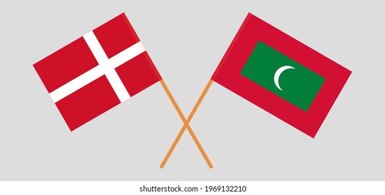 Crossed flags of Denmark and Maldives. Official colors. Correct proportion