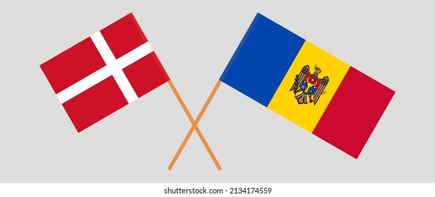 Crossed flags of Denmark and Moldova. Official colors. Correct proportion. Vector illustration
