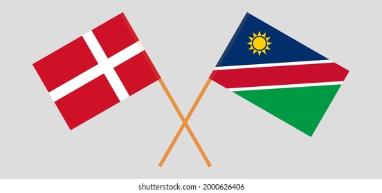 Crossed flags of Denmark and Namibia. Official colors. Correct proportion