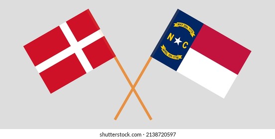 Crossed flags of Denmark and The State of North Carolina. Official colors. Correct proportion. Vector illustration