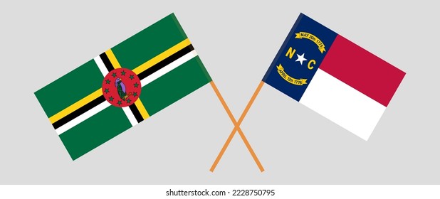 Crossed flags of Dominica and The State of North Carolina. Official colors. Correct proportion. Vector illustration
