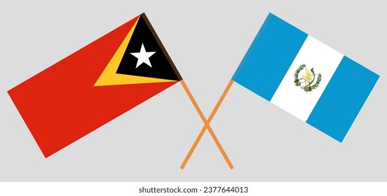 Crossed flags of East Timor and Guatemala. Official colors. Correct proportion. Vector illustration
