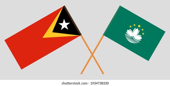 Banderas cruzadas de Timor Oriental y Macao. Colores oficiales. Proporción correcta