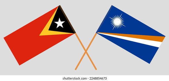 Crossed flags of East Timor and Marshall Islands. Official colors. Correct proportion. Vector illustration
