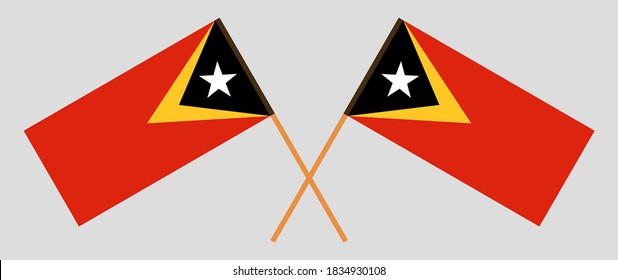 Crossed flags of East Timor. Official colors. Correct proportion. Vector illustration
