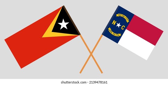 Crossed flags of East Timor and The State of North Carolina. Official colors. Correct proportion. Vector illustration
