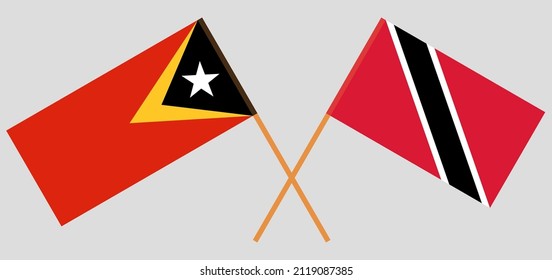 Gekreuzte Flaggen von Osttimor, Trinidad und Tobago. Offizielle Farben. Richtiger Anteil. Vektorgrafik