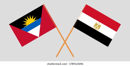 Crossed flags of Egypt and Antigua and Barbuda. Official colors. Correct proportion. Vector illustration
