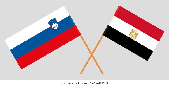 Crossed flags of Egypt and Slovenia. Official colors. Correct proportion. Vector illustration
