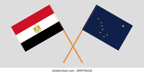 Crossed flags of Egypt and the State of Alaska. Official colors. Correct proportion. Vector illustration
