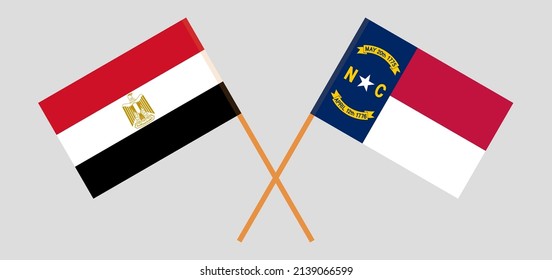 Crossed flags of Egypt and The State of North Carolina. Official colors. Correct proportion. Vector illustration
