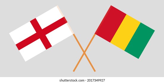 Crossed flags of England and Guinea. Official colors. Correct proportion