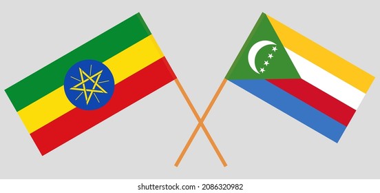 Crossed flags of Ethiopia and the Comoros. Official colors. Correct proportion. Vector illustration
