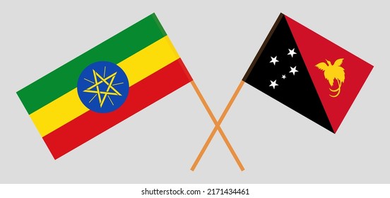 Crossed flags of Ethiopia and Papua New Guinea. Official colors. Correct proportion. Vector illustration
