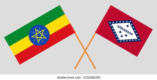 Crossed flags of Ethiopia and The State of Arkansas. Official colors. Correct proportion. Vector illustration
