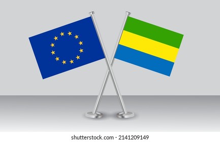 Crossed flags of European Union (EU) and Gabon. Official colors. Correct proportion. Banner design