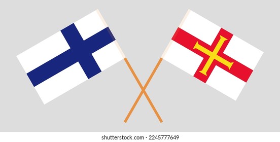 Crossed flags of Finland and Bailiwick of Guernsey. Official colors. Correct proportion. Vector illustration
