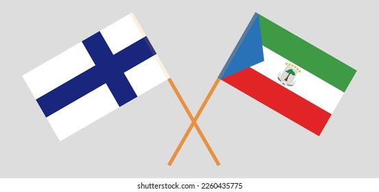 Crossed flags of Finland and Equatorial Guinea. Official colors. Correct proportion. Vector illustration
