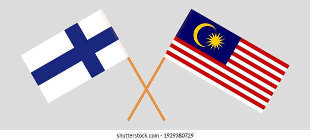 Crossed flags of Finland and Malaysia. Official colors. Correct proportion